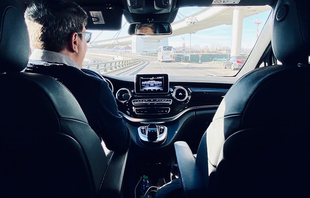 A chauffeur driving an executive vehicle